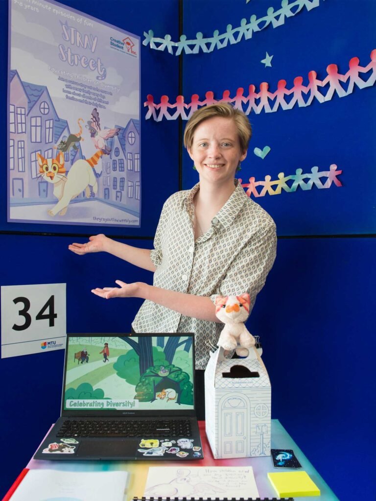 Gray-Lawless,-Student-of-IADT-showcasing-a-project-at-the-Student-Inc-Showcase,-The-Arena,-MTU-Bishopstown-Campus