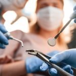 First person view. Three doctors are working. In the stomatological cabinet