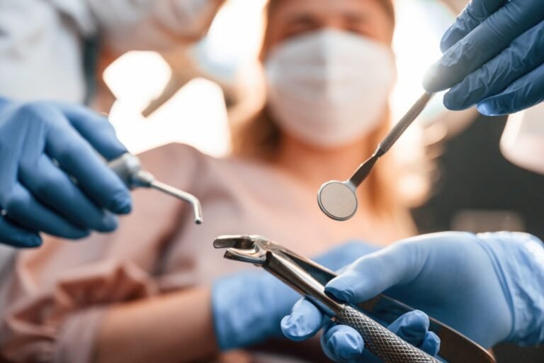 First person view. Three doctors are working. In the stomatological cabinet
