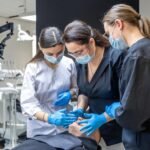 team-female-dentists-treating-patients-teeth-visit-dentist-dentistry_169016-67227